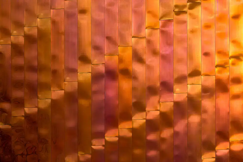 Close-up detail of modern copper planters in an office environment